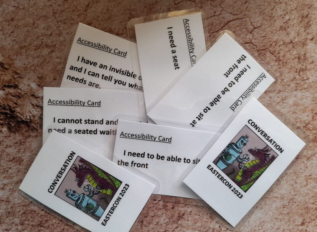 A small pile of cards with Conversation logo on one side and a note about access needs on the other